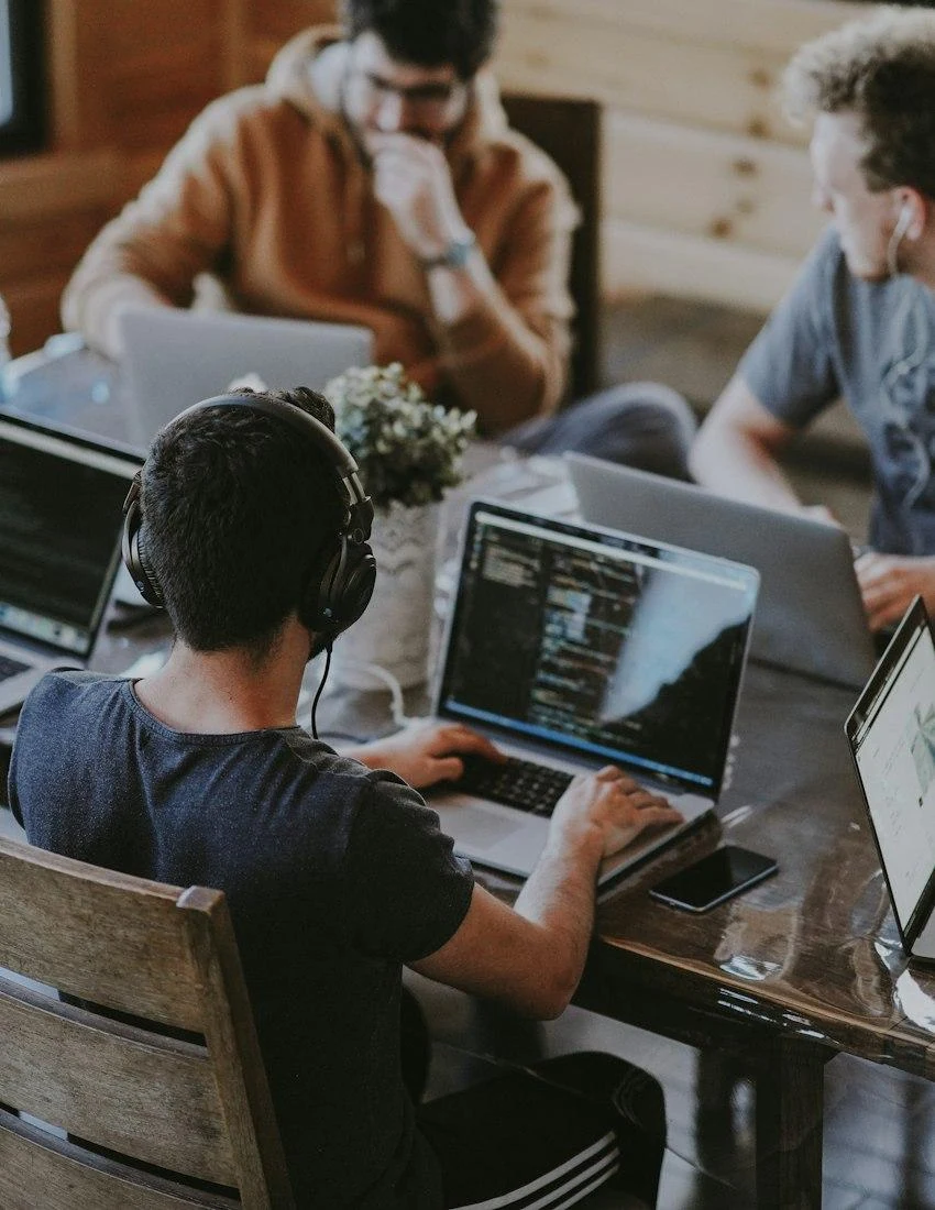 Illustrative research team working together in a technology workspace; not a photo of existing Kira Labs employees