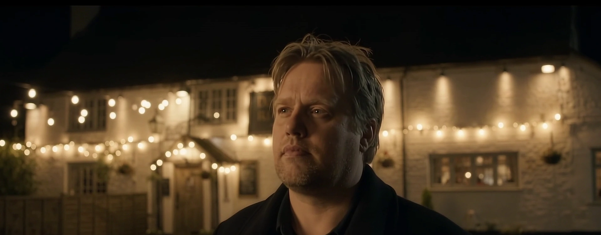 Unaltered screenshot from Robert's outdoor-pub video, with natural hair and expression